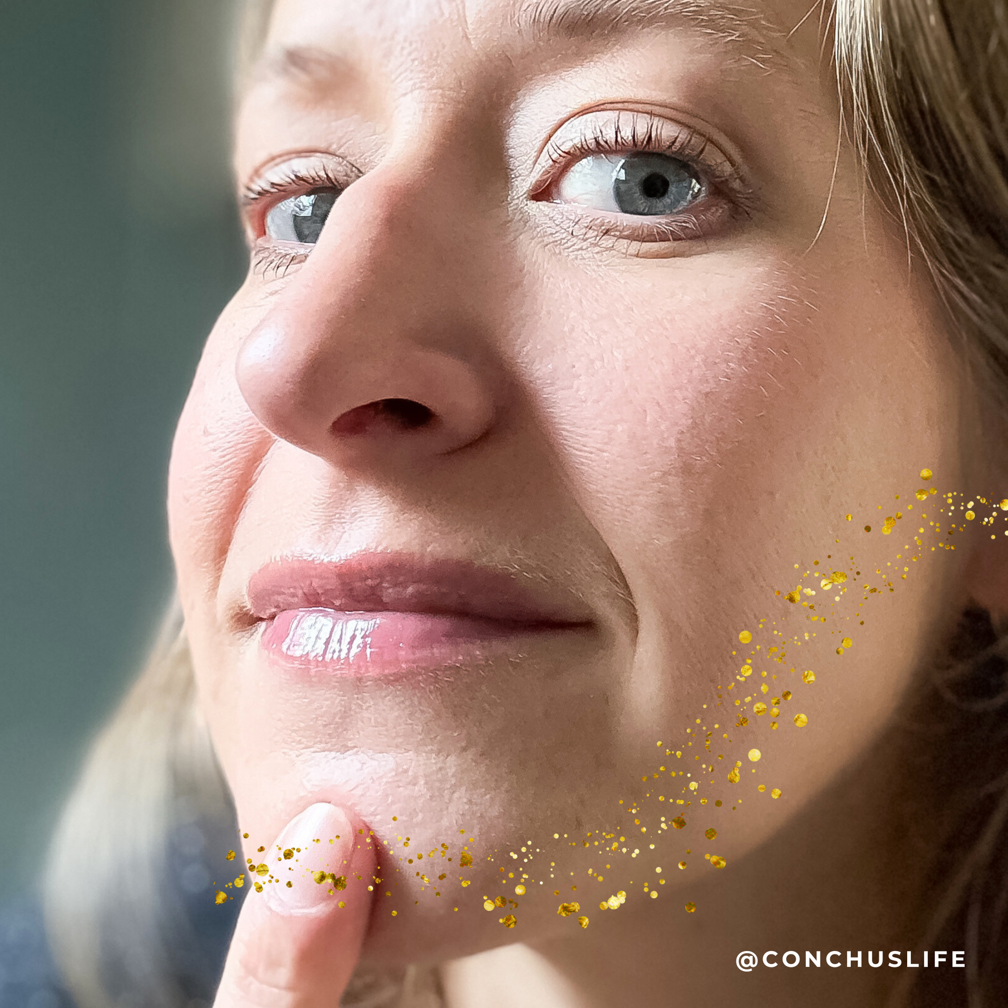 Person applying CONCHUS MERRY Lip Gloss to lips showing natural glossy finish