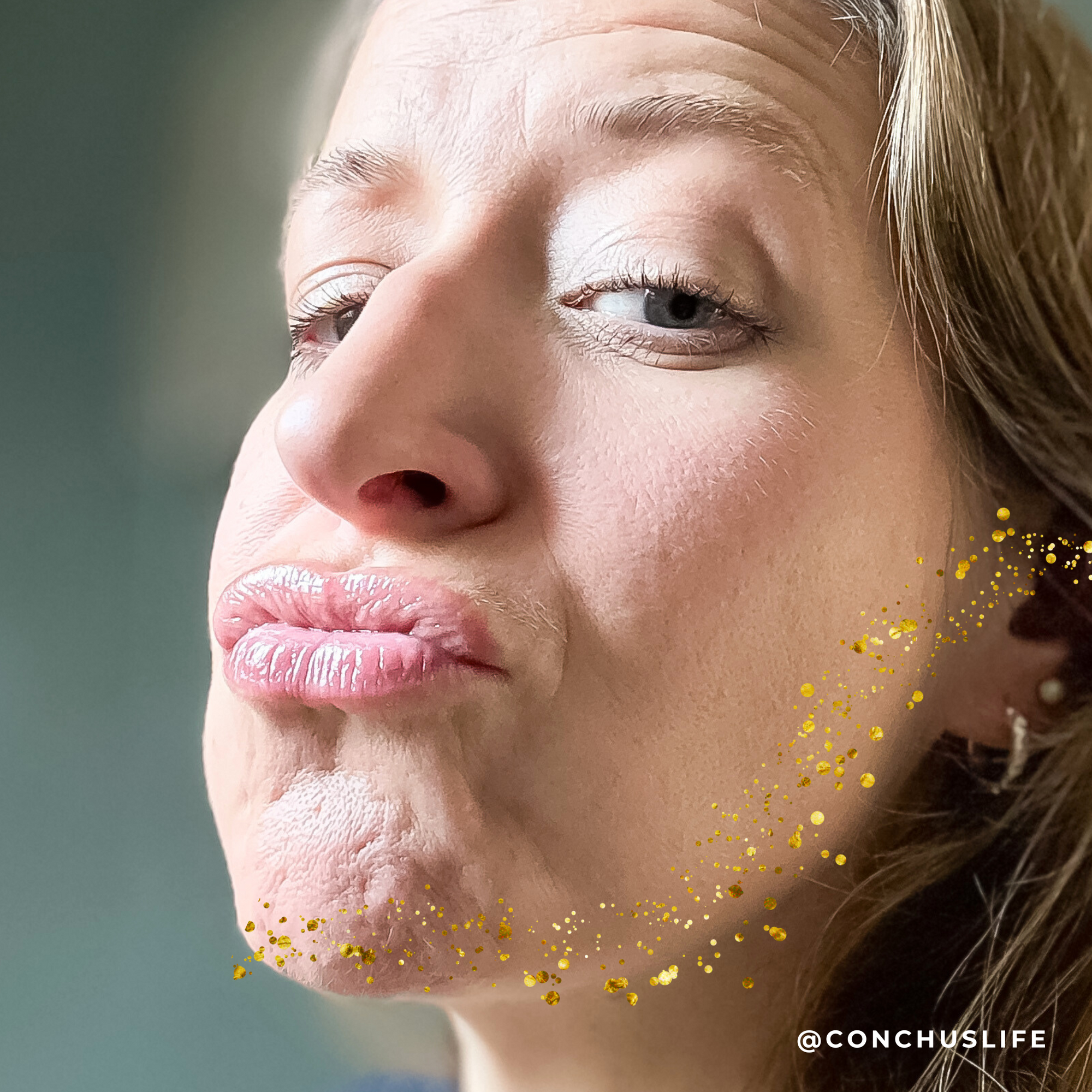 Person wearing CONCHUS MERRY Lip Gloss showing subtle festive shimmer