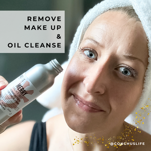 Person using CONCHUS MERRY Light Oil to remove makeup as part of an oil cleanse.