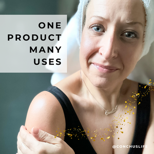 Person showing CONCHUS MERRY Light Oil with one product many uses message.