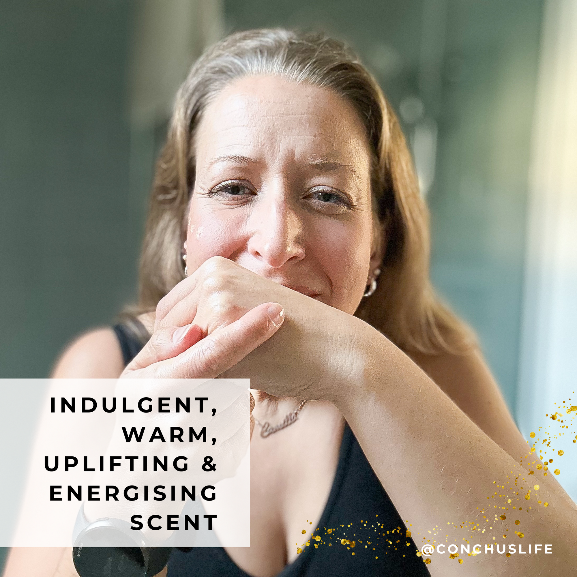 Person smelling CONCHUS MERRY Body Butter to show warm uplifting festive essential oil blend