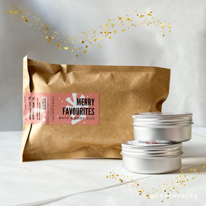 Biodegradable pouch containing CONCHUS MERRY Bath & Body Duo with two mid-size skincare tins